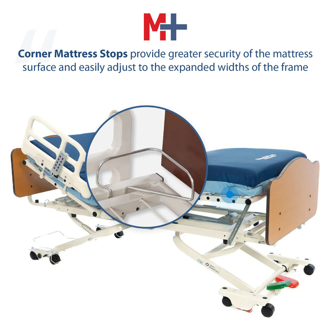 Hospital bed with corner mattress stops and M+H logo on a white background